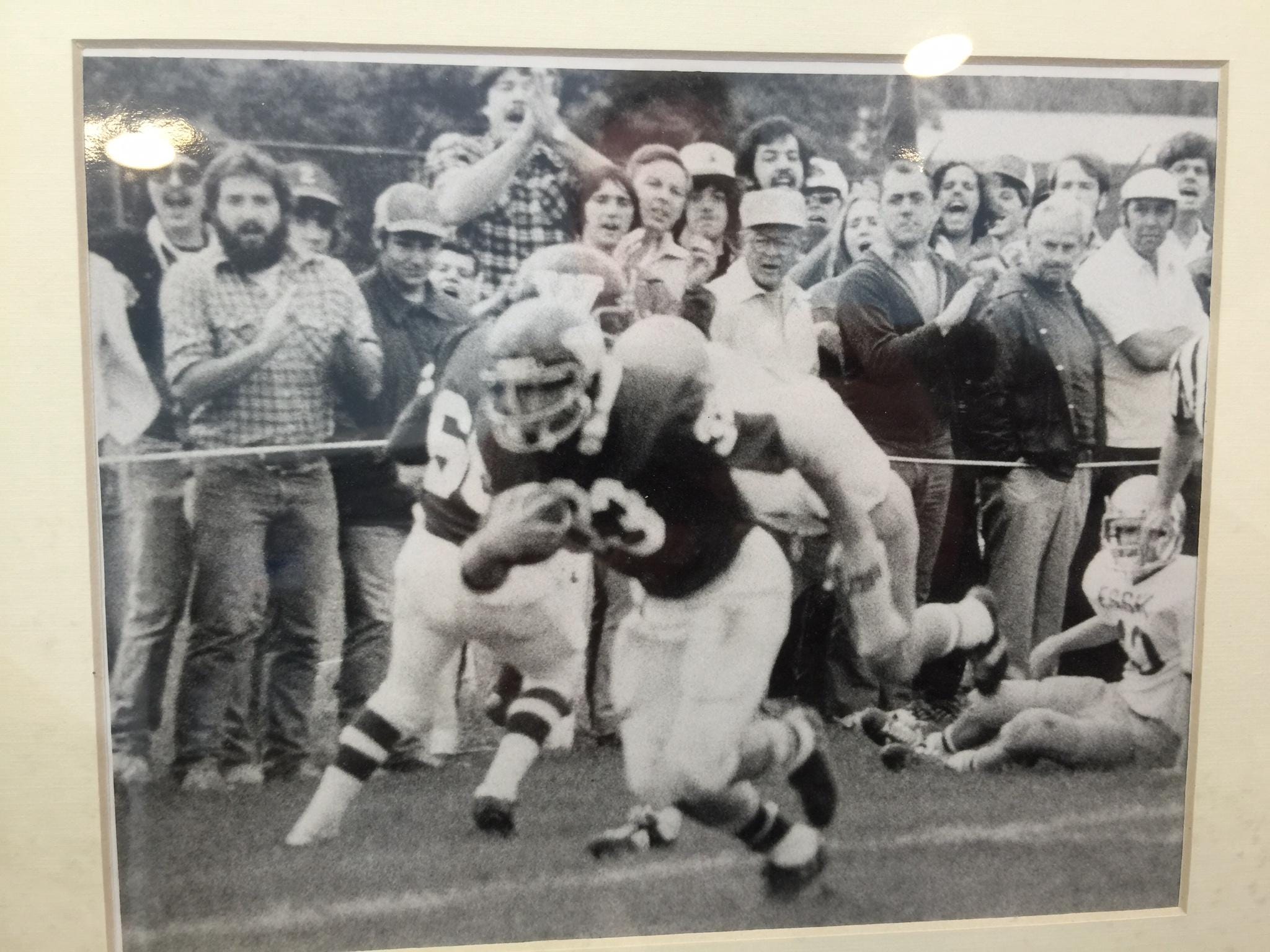 Glenn Cummings runs with the ball as a member of the Winooski High School football team in the late 1970s.