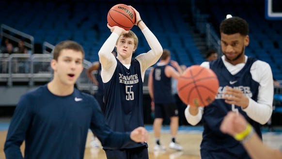 Xavier Musketeers guard J.P. Macura (55) shoots from