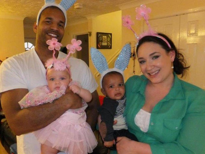 Kenika Ng (L) and Ashley Ng (R) hold their twins Viviana (L) and Dennis (R) as they pose for a photo. Ashley Ng shared this with News10 on Wednesday, Oct. 30, 2014.