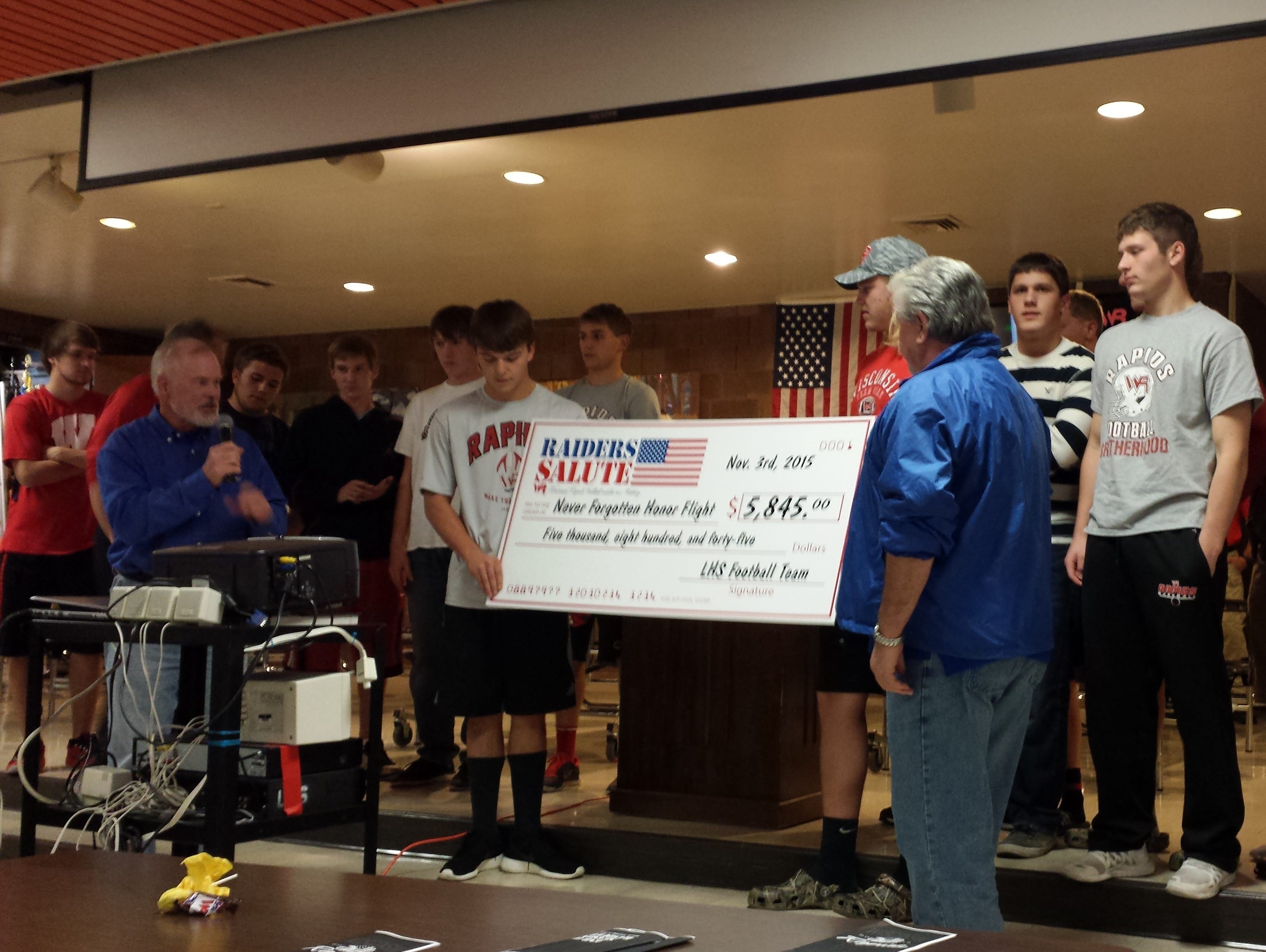 The Lincoln High School football team presented a donation for $5,845 to Jim Campbell and Mike Thompson, co-founders of the Never Forgotten Honor Flight, during its banquet Wednesday. Campbell and Thompson told the team the donation would send about 11 veterans on the trip to Washington, D.C., to visit the memorials created to honor World War II, Korean and Vietnam veterans. The team sold “Raider Salute” T-shirts to raise funds for the Honor Flight, and donations also were accepted at its Oct. 16 game. During that game the American Legion Riders also presented the Colors.
