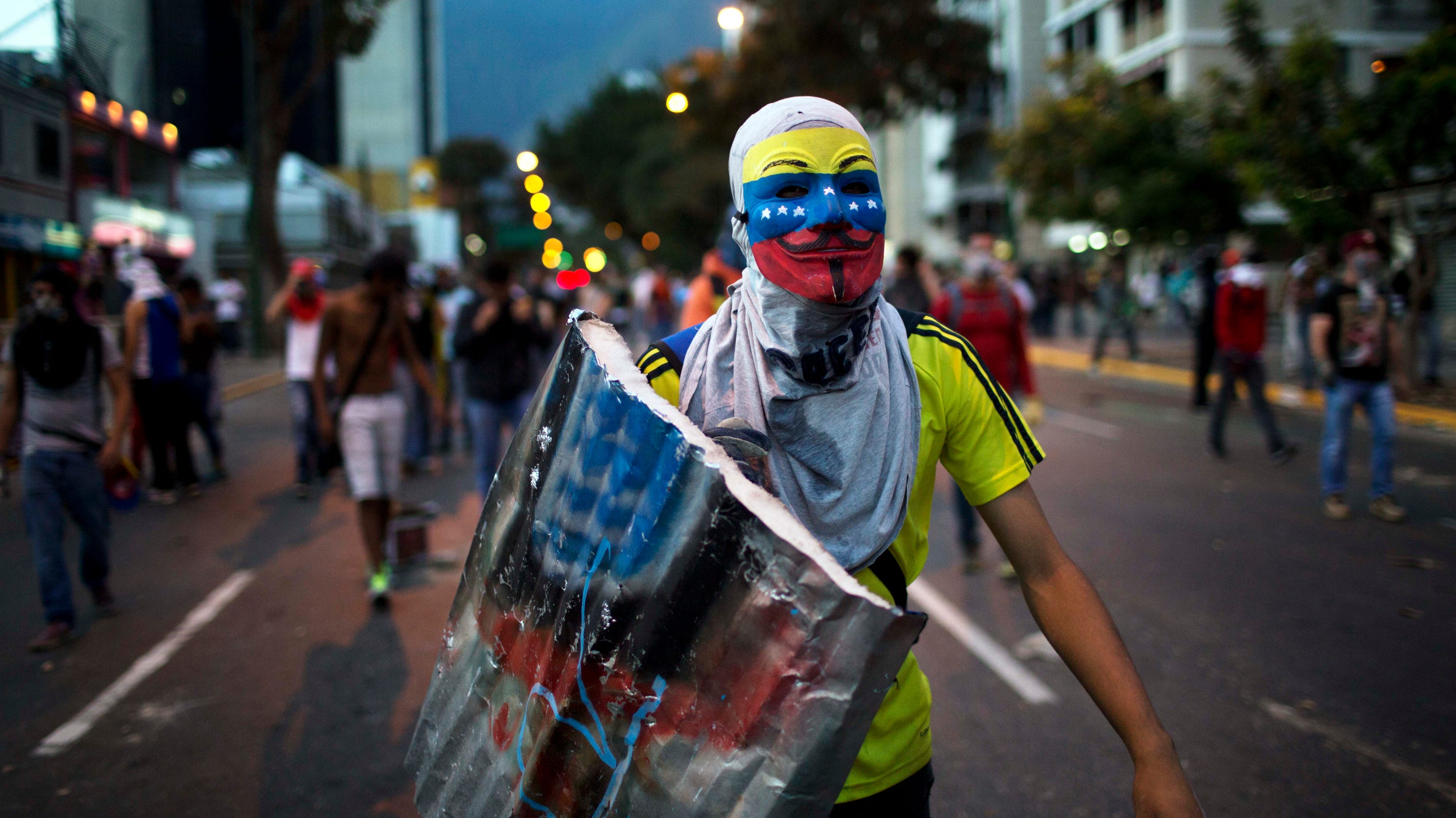 Venezuelans weary but determined after month of protests