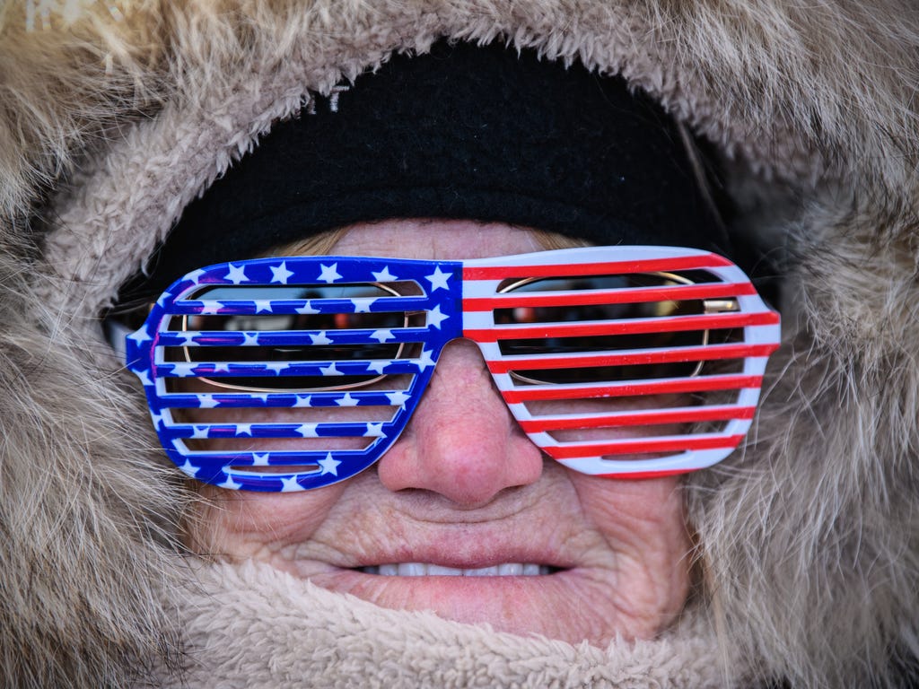 A woman in U.S.A novelty glasses poses for a photograph ahead of the Men's Halfpipe Qualification Run snowboarding competition at Phoenix Park on day four of the PyeongChang Winter Olympics on Feb. 13, 2018 in Pyeongchang-gun, South Korea.