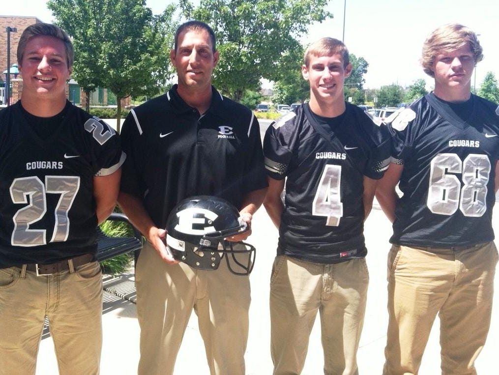 South Lyon East has a new coach in Joe Pesci, who is flanked by returnees (from left) Shane Patterson, Josh Smith and Joel Trent.