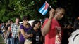 People wait in line to pay respect to Cuba
