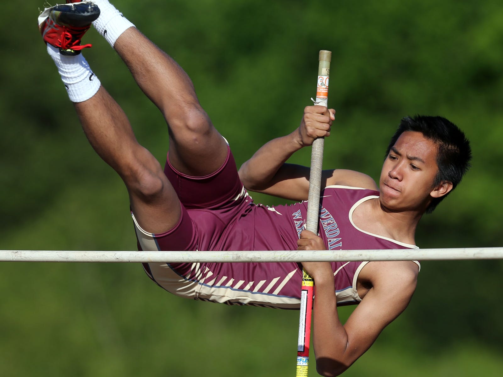 Riverdale's Bryan Abriol competes in the pole vault Monday. Abriol finished fourth, clearing 8 feet.