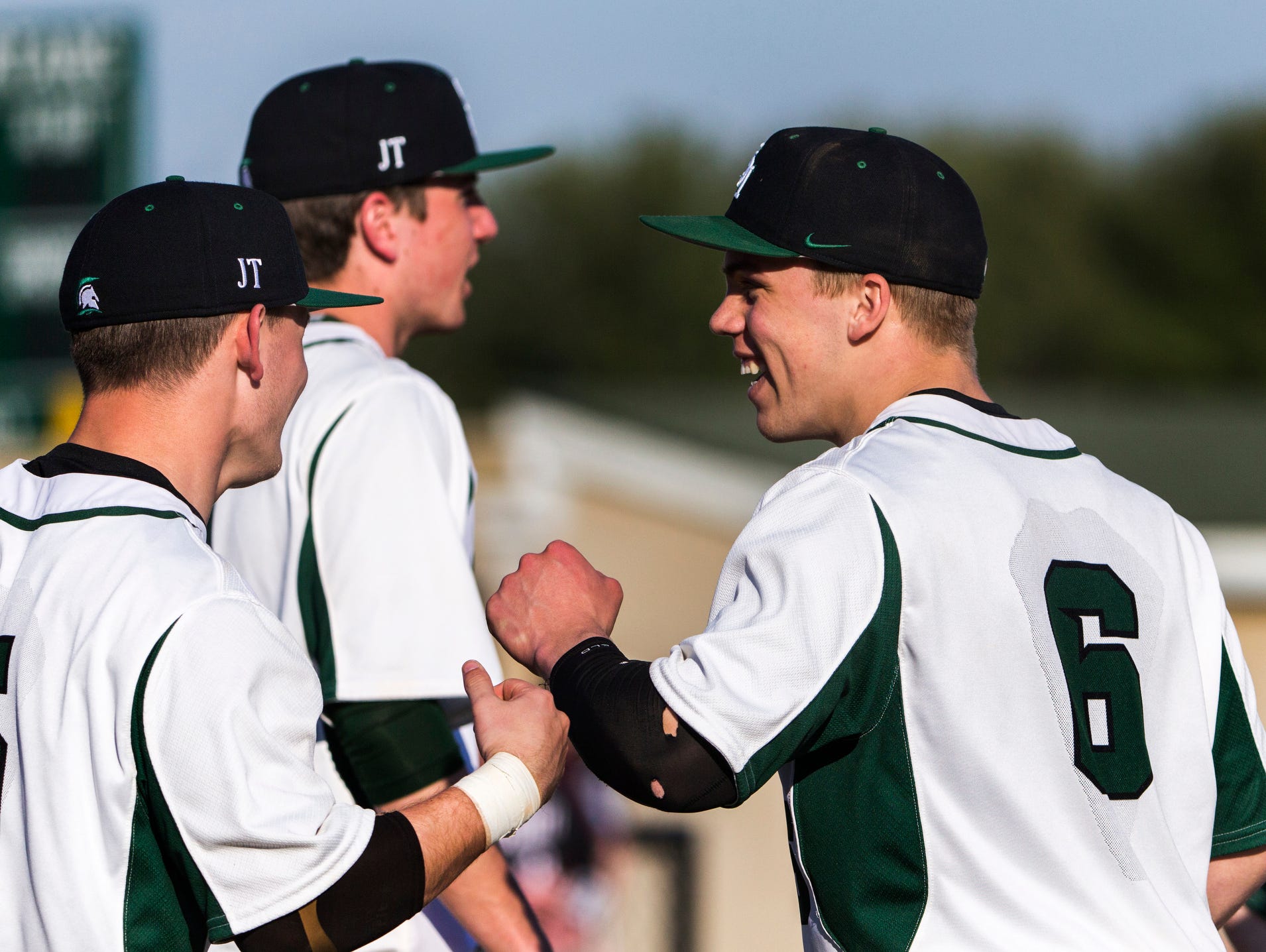 St. Mark's pitcher Andrew Reich (No. 6) celebrates with teammates after throwing a no-hitter in St. Mark's 12-0 win over Hodgson at St. Mark's High School on Wednesday afternoon.