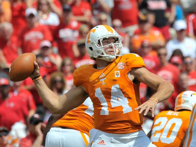 Sep 7, 2013; Knoxville, TN, USA; Tennessee Volunteers quarterback Justin Worley (14) passes against the Western Kentucky Hilltoppers during the first half at Neyland Stadium. Mandatory Credit: Jim Brown-USA TODAY Sports