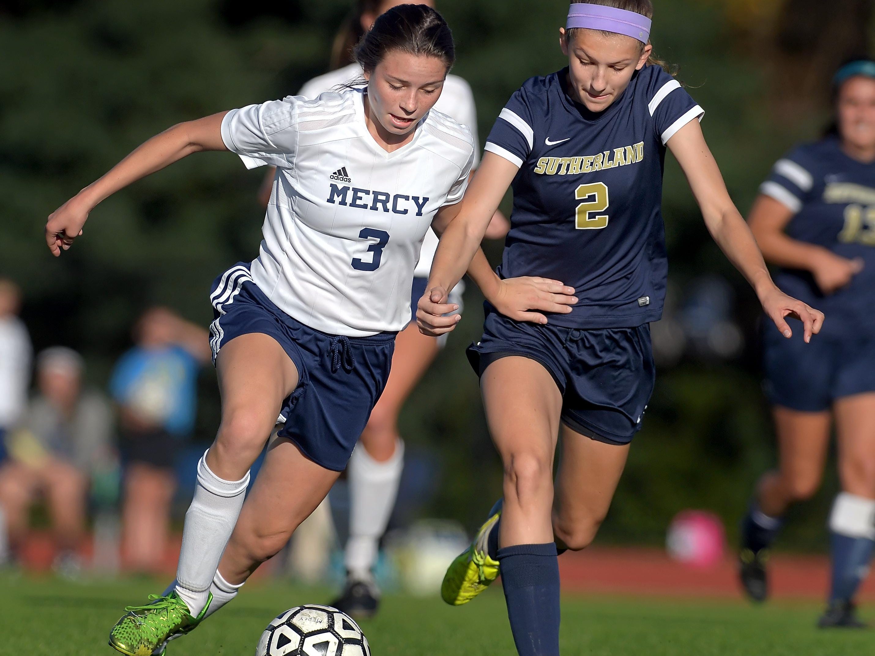 Mercy’s Emily Wade, left, and Pittsford Sutherland’s Claire Anvelt battle for position on the ball at Our Lady of Mercy High School on Monday. Pittsford Sutherland beat Mercy, 2-0.