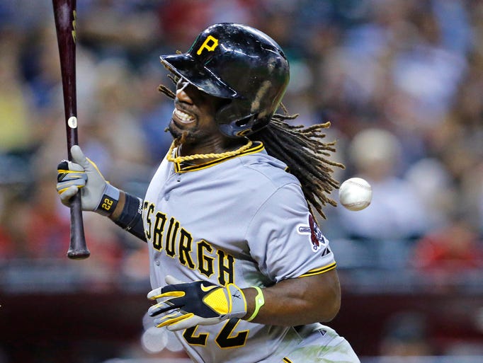 Pittsburgh Pirates center fielder Andrew McCutchen (22) gets hit with a pitch in the 9th inning of their MLB game against the Arizona Diamondbacks Saturday, Aug. 2, 2014 in Phoenix, Ariz.