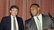 Heavyweight champion Mike Tyson, right, speak at a