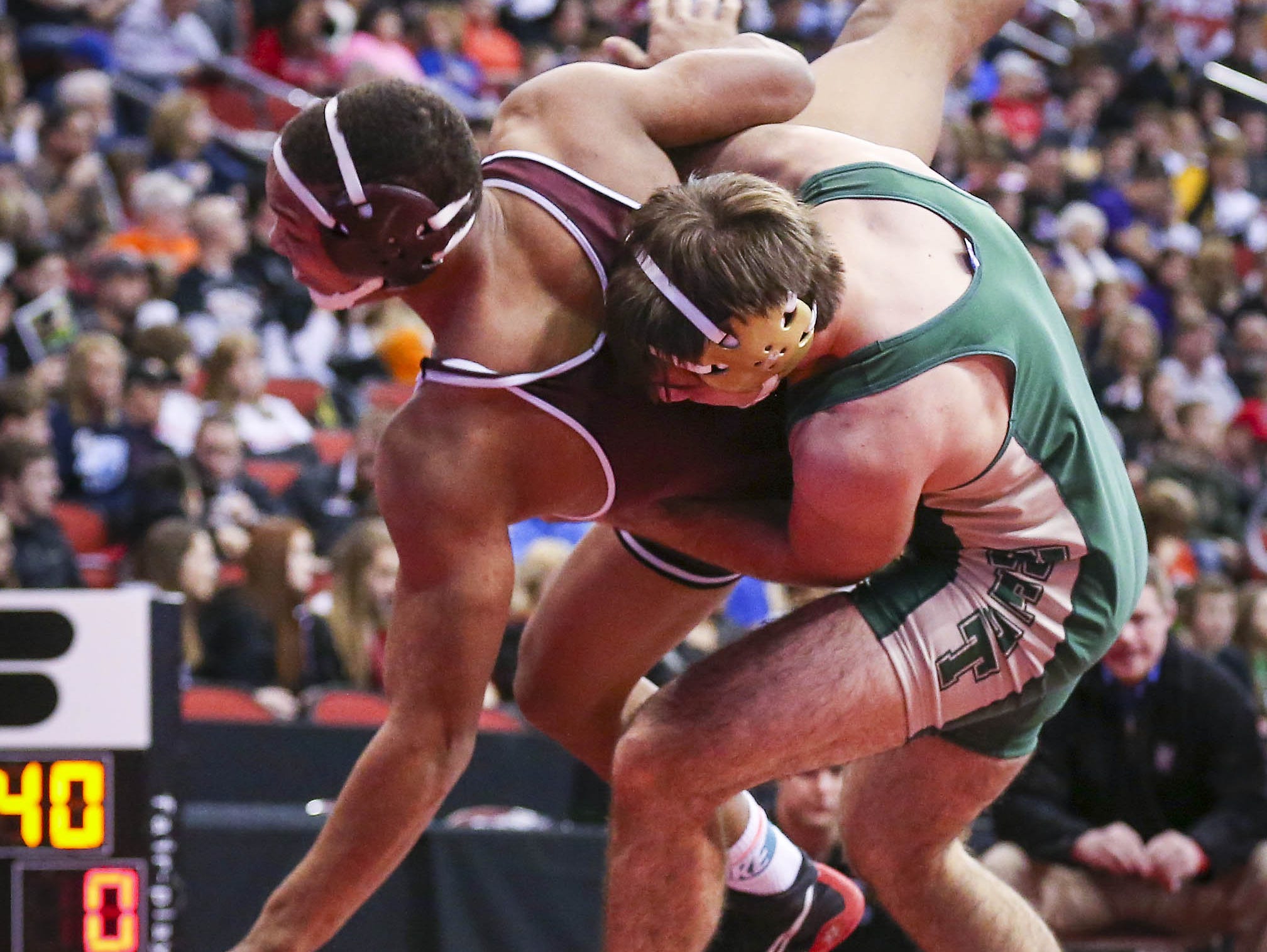 Donovan Doyle (Iowa City West), right, controls Jacob Zachary (Dowling Catholic, WDM) during their 182lbs Class 3A first round match during the 2015 state wrestling championships Thursday Feb. 19, 2015, at Wells Fargo Arena in Des Moines, Iowa.