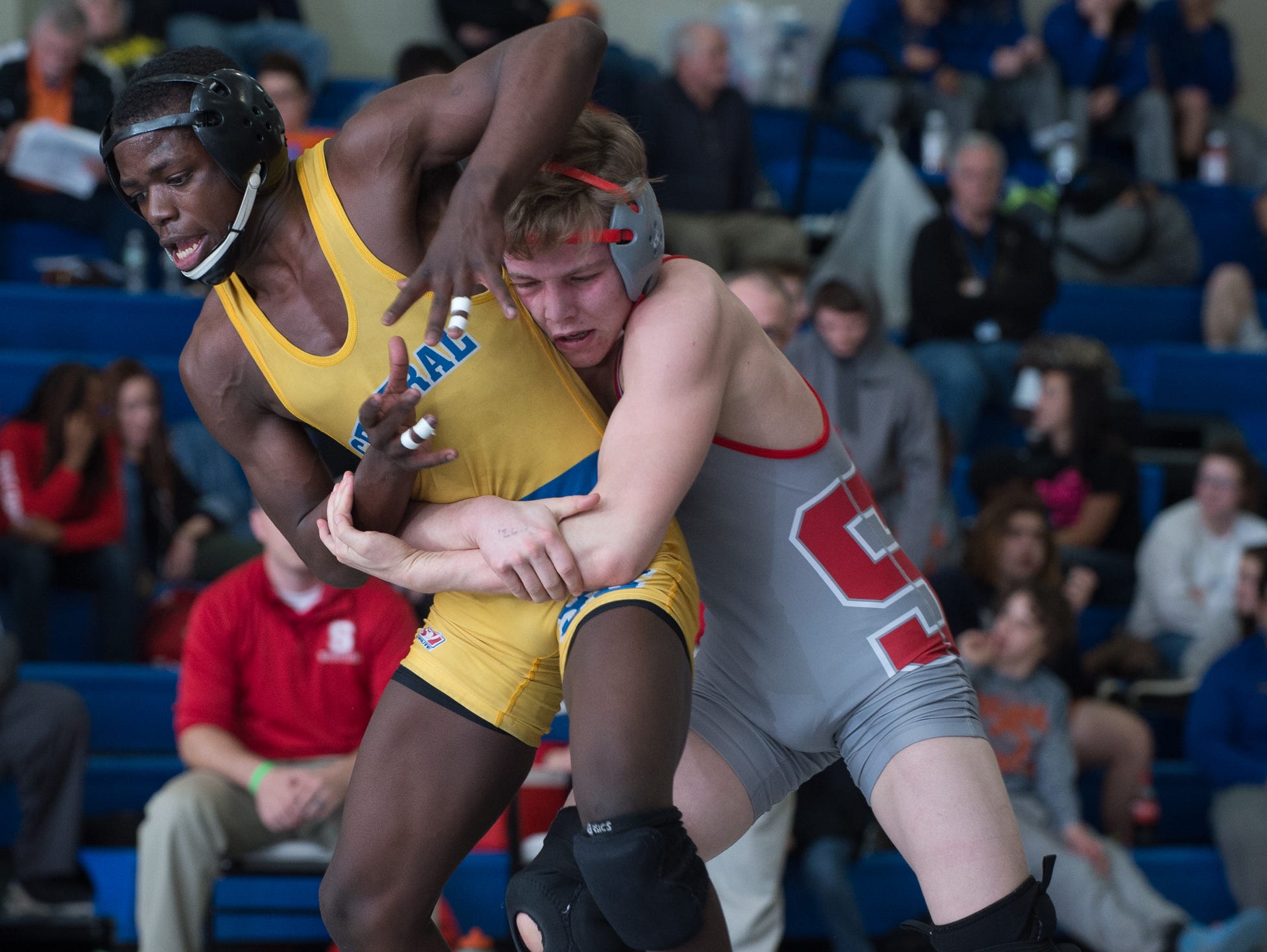 Smyrna's Cole Sebastianelli, right wrestles Sussex Central's Rashad Stratton in the 126 pound final match at the Henlopen Conference wrestling championships at Dover High School.
