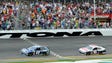 Jimmie Johnson crosses the finish line to win the 2013