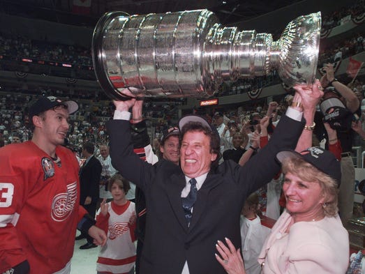 Mike and Marian Ilitch hoist the Stanley Cup on June