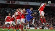 Arsenal's Granit Xhaka heads the ball away from Chelsea's