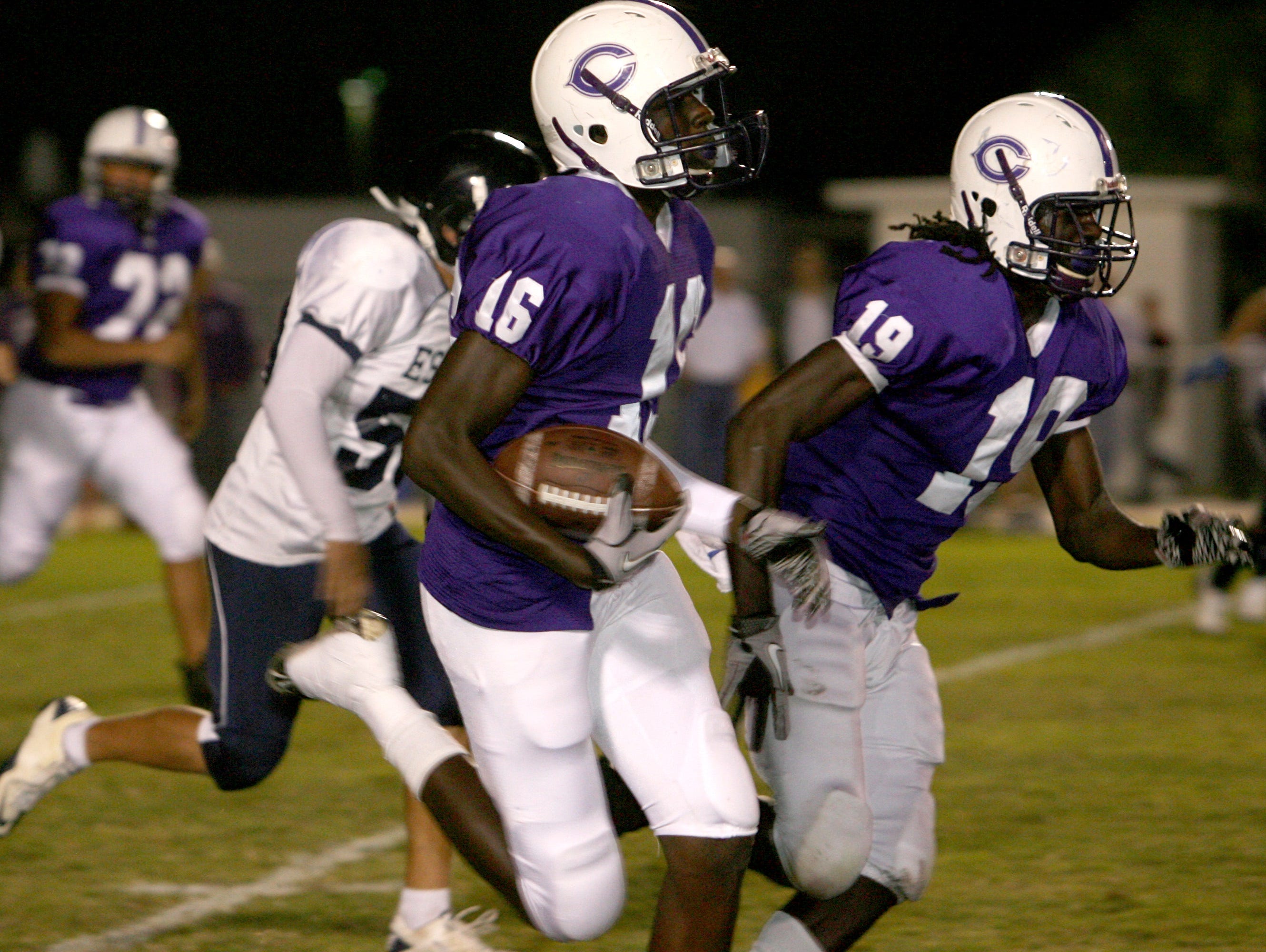 Cypress Lake's Jayron Kearse gets blocking from De'Vondre Campbell in a game from 2010.