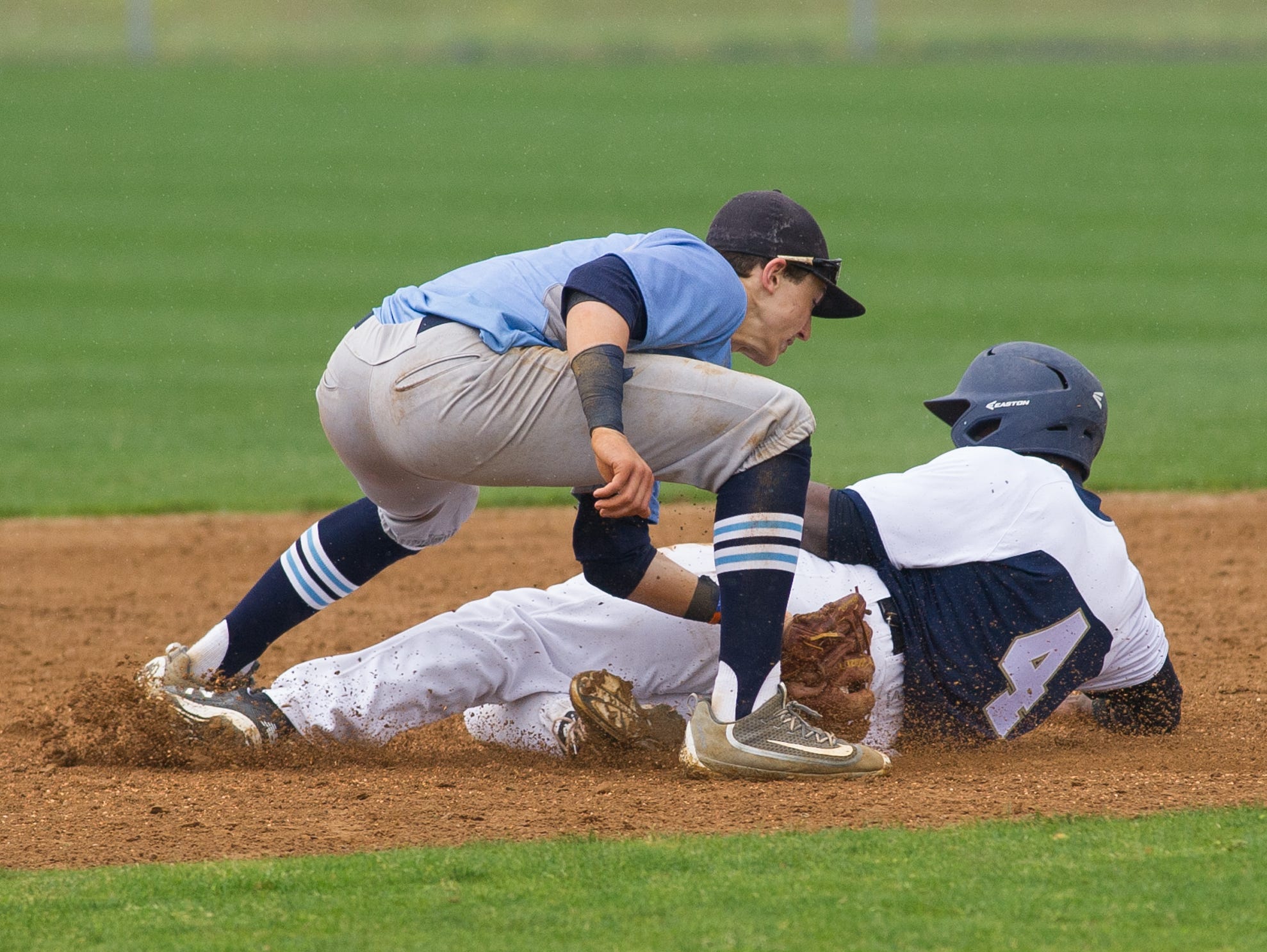 Cape Henlopen's pitcher Zachary Gelof (11) tags out Salesianum's Joshua Patrick (4) out at second base.