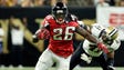 Falcons running back Tevin Coleman (26) eludes Saints