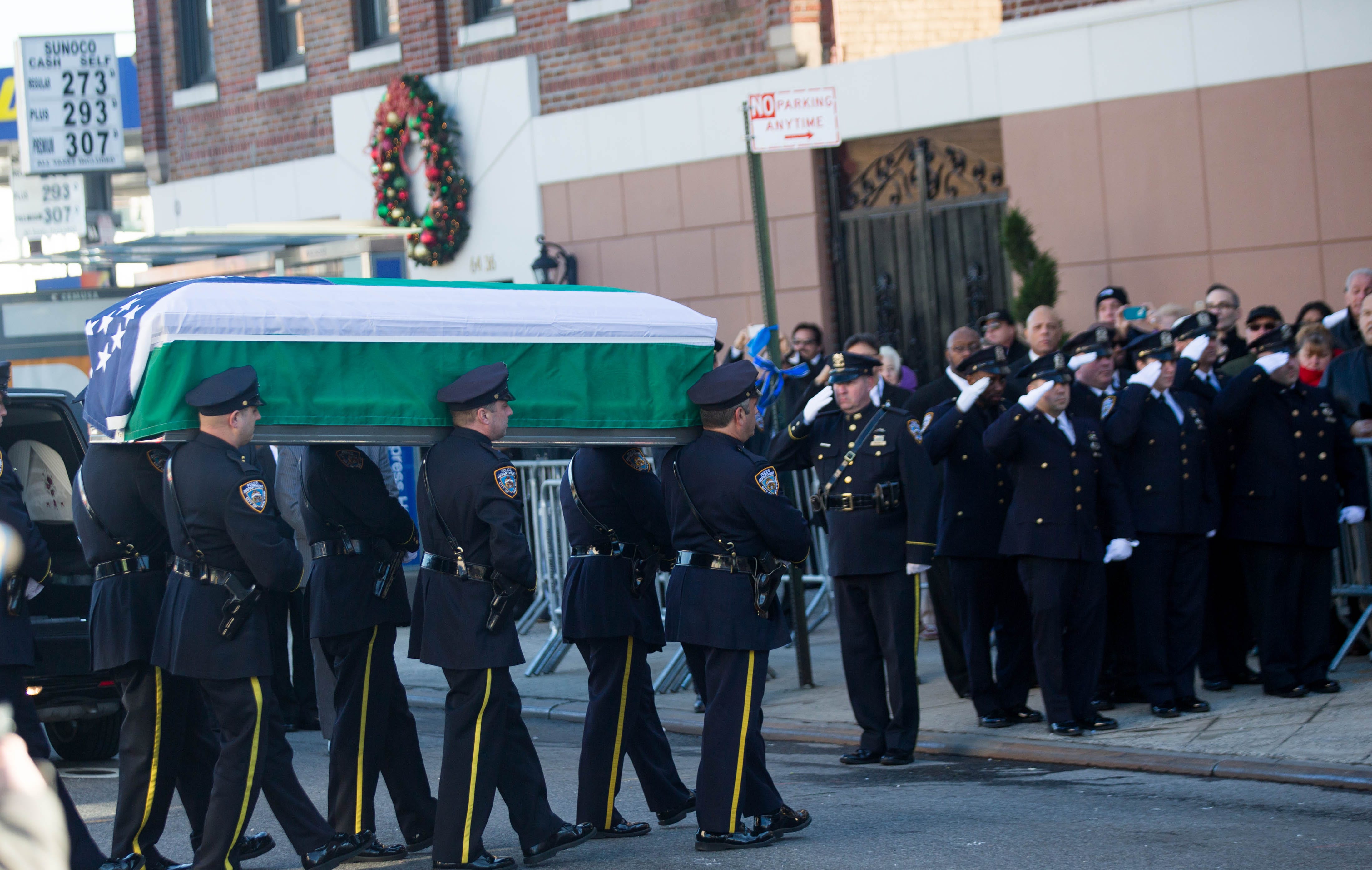 In a sea of blue, NYC cops honor slain officer