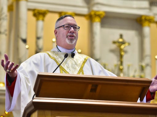 Bishop Christopher Coyne speaks after being installed
