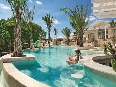 The white marble swim-up bar at the Dominican Republic's Eden Roc at Cap Cana is designed in the style of the French Riviera's glam resorts.
