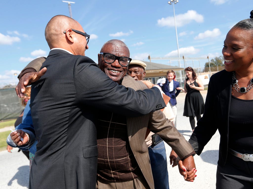 Wilbert Jones hugs William Aquino, attorney for Innocence Project New Orleans, as he leaves East Baton Rouge Parish Prison with his niece Wajeedah Jones.  Jones, who has spent nearly 50 years in prison was freed after a judge overturned his convictio