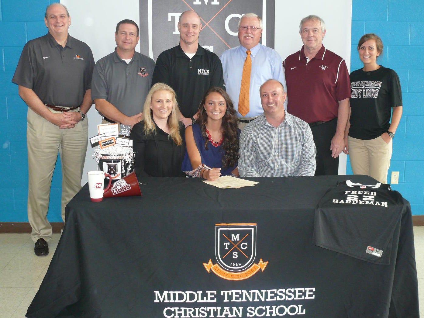 MTCS senior Ashlynd Wilkerson signed with Freed-Hardeman. In the front, from left, are mom Callan Wilkerson, Ashlynd Wilkerson and dad Brad Wilkerson. In the back, from left, is MTCS President Phil Ellenburg, MTCS Principal Todd Miller, MTCS Athletic Director Jason Piercey, MTCS girls basketball coach Lynn Burkey, Freed-Hardeman women’s coach Dale Neal and Freed-Hardeman assistant Alissa Hargett.