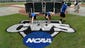 Groundskeepers paint the College World Series logo