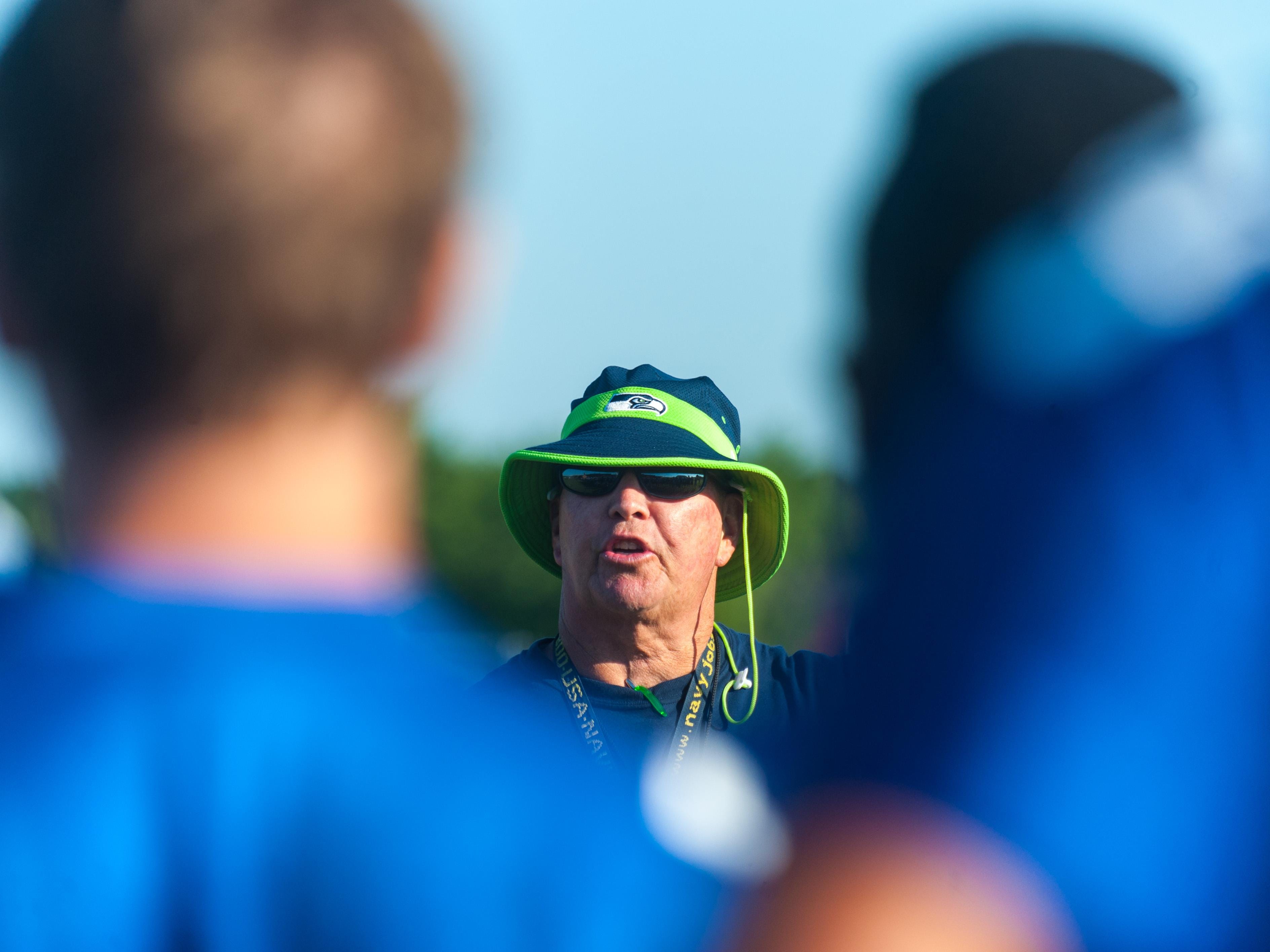 Stephen Decatur head coach Bob Knox talks to his team in a pre-practice session in Berlin.