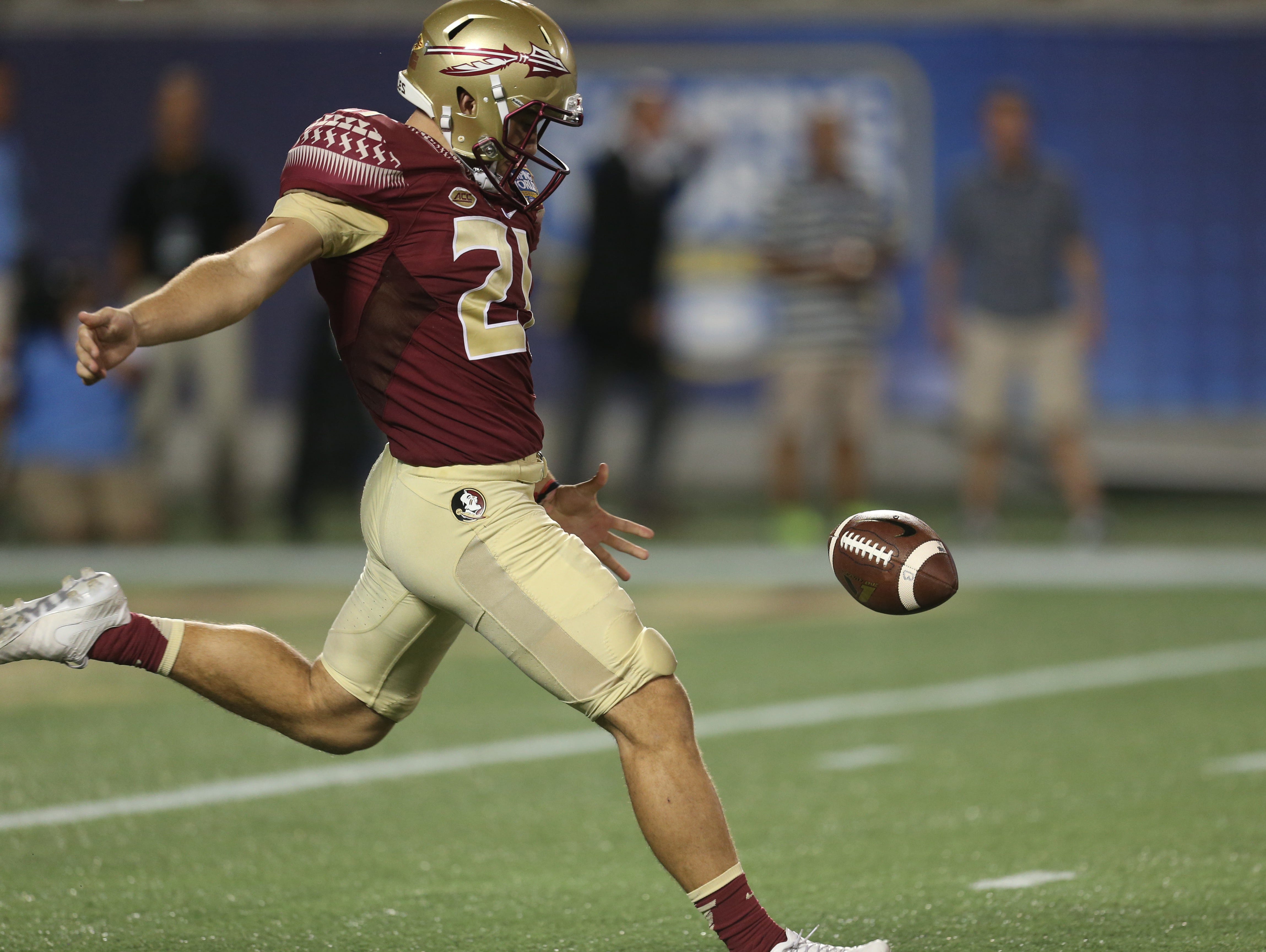 FSU’s Logan Tyler punts the ball during a game against Ole Miss at Camping World Stadium on Monday, Sept. 5, 2016.