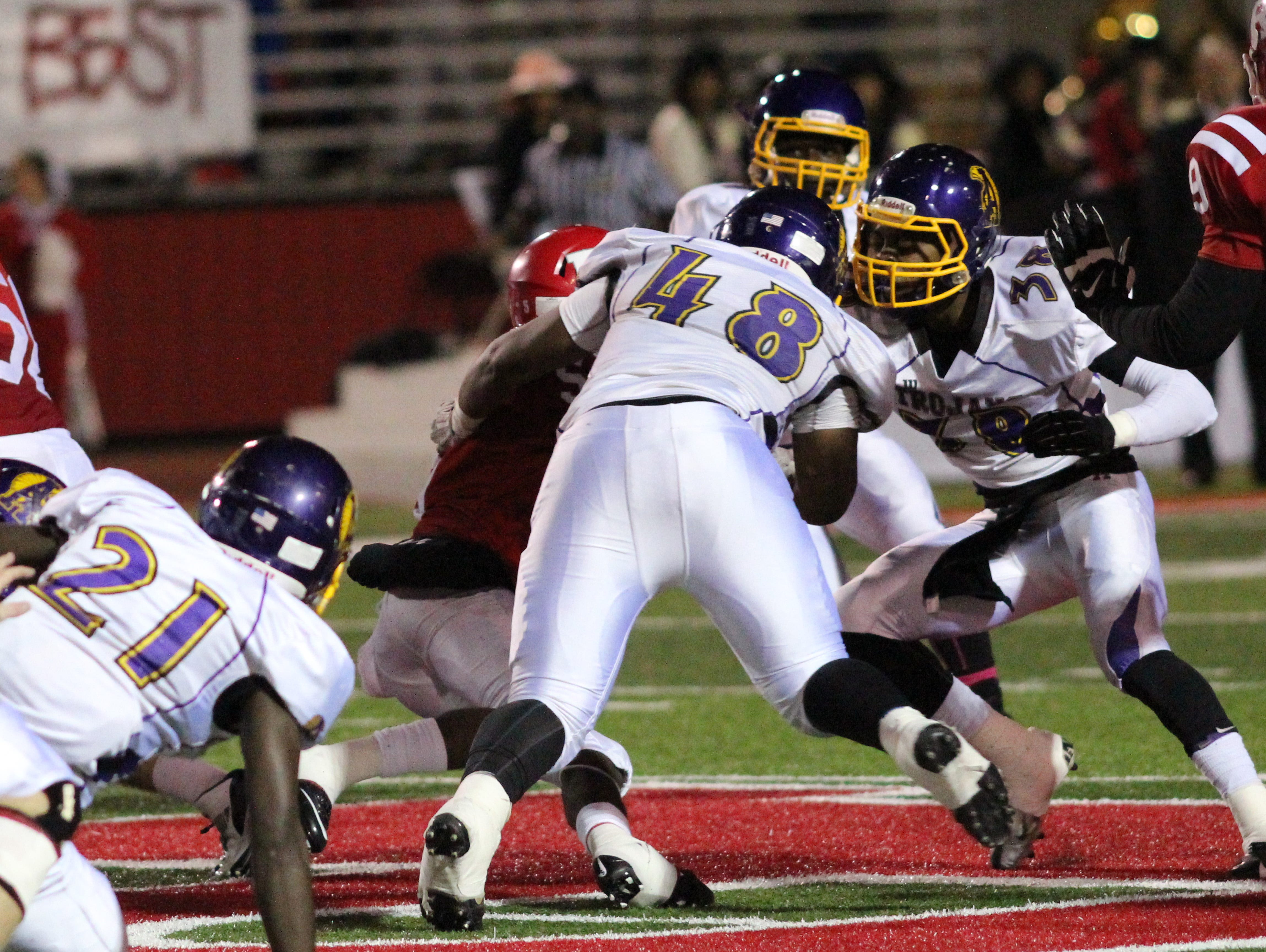 ASH junior defensive tackle Kolby Parker (48) makes a tackle against Ruston last Friday. Parker, who moved from defensive end to defensive tackle due to injuries, has battled through a nagging ankle injury to keep being productive for the Trojans’ defense.