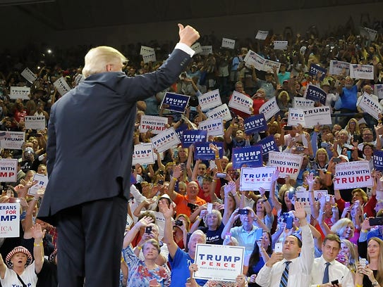 Donald Trump acknowledges supporters during a campaign