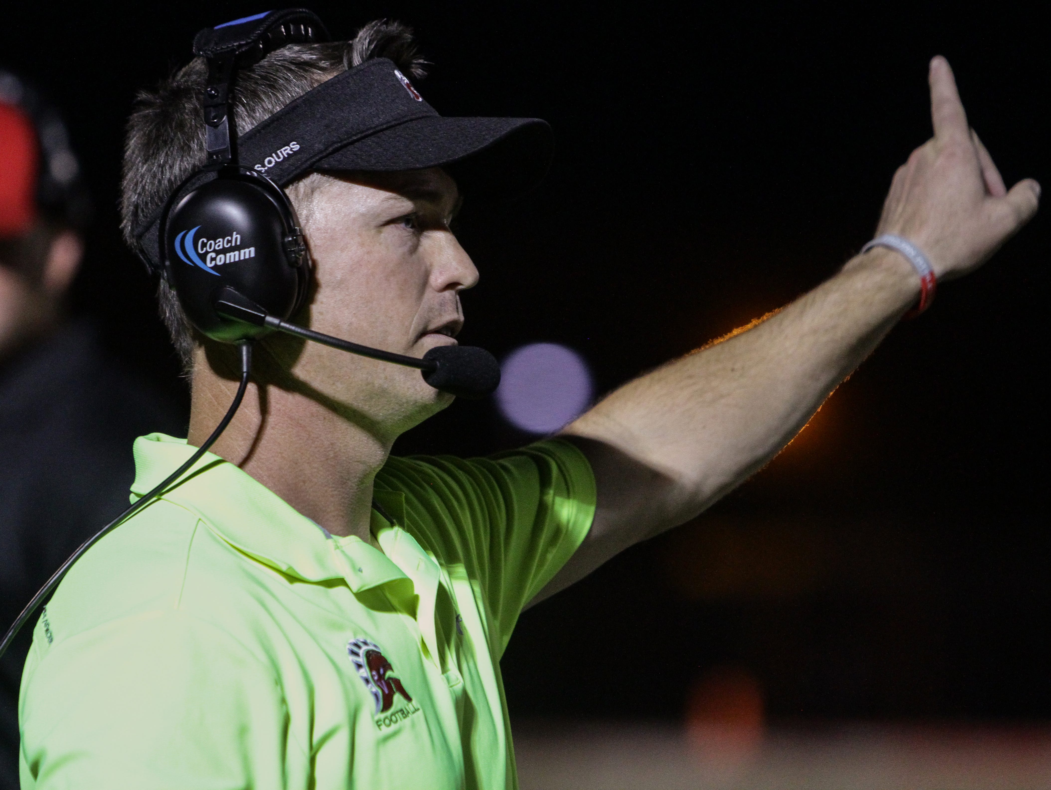 Paradise Valley head coach Greg Davis signals to his team against Sunnyslope on Friday, September 11, 2015 in Paradise Valley, AZ.