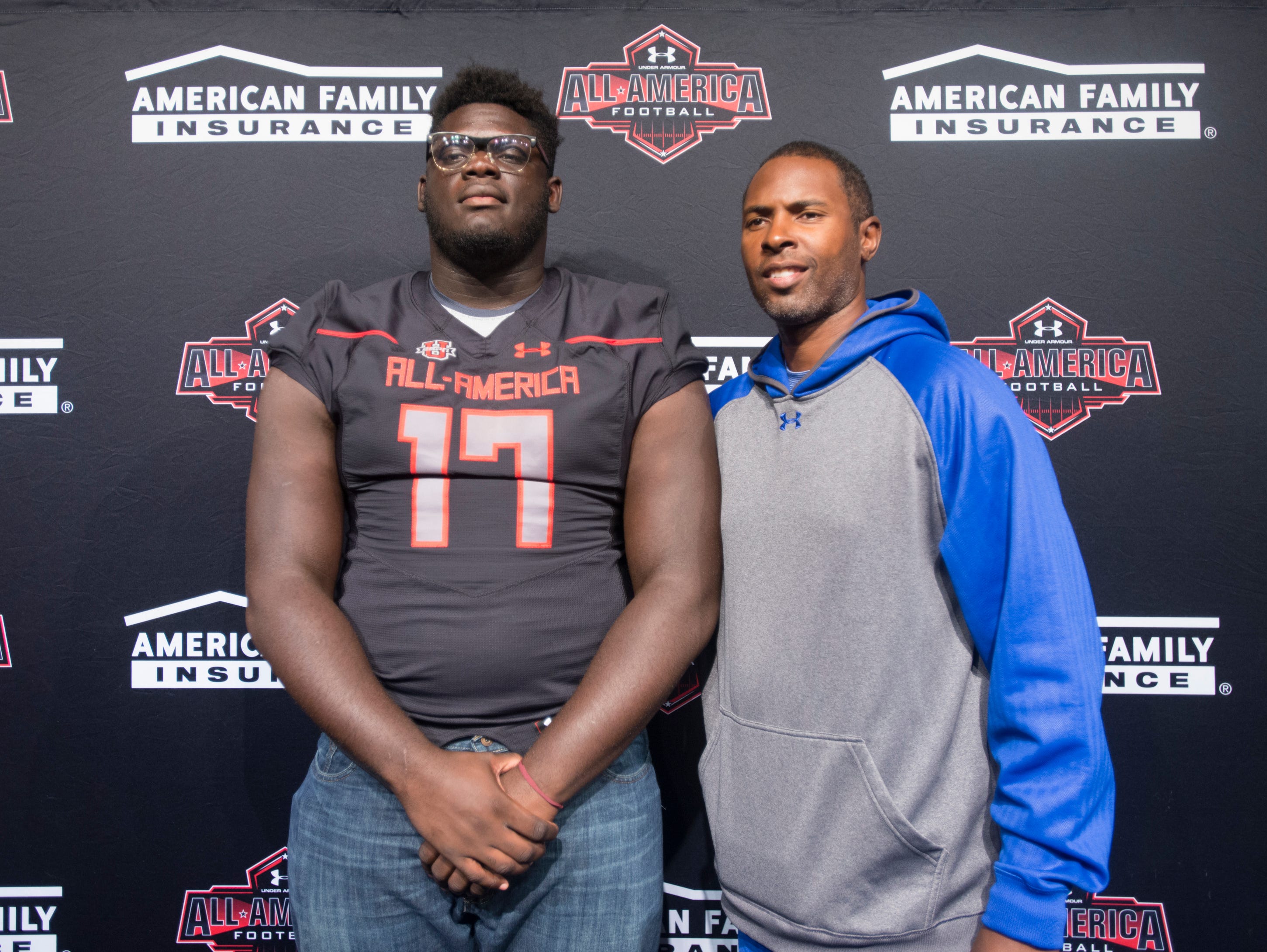 Football player Alex Leatherwood and coach Charlie Ward pose for a photo during the event announcing that Leatherwood has been selected for the annual Under Armour High School All-America Game at Booker T. Washington High School in Pensacola on Wednesday, October 12, 2016. The game featuring more than 90 of the nation's best senior high school football players will be played on January 1, 2017.