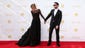 <p>Newlywed Adam Levine was another Prada score, wearing a black tux, while his better half, model Behati Prinsloo, also went with the Italian brand, donning a black long-sleeve gown. </p>