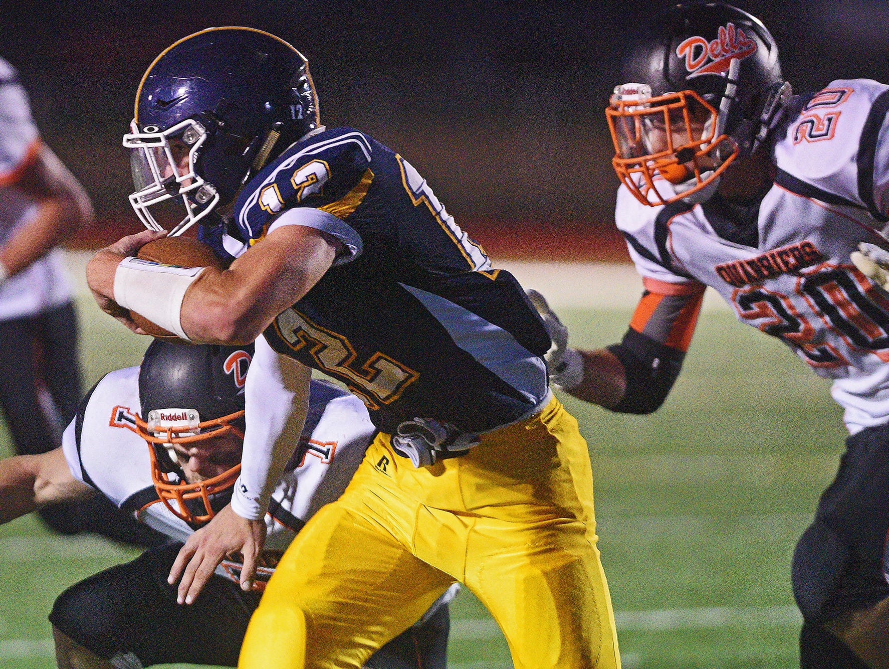 Tea Area's Payton Conrad (12) carries the ball during a game against Dell Rapids Friday, Sept. 16, 2016, at Tea Area High School in Tea, S.D.