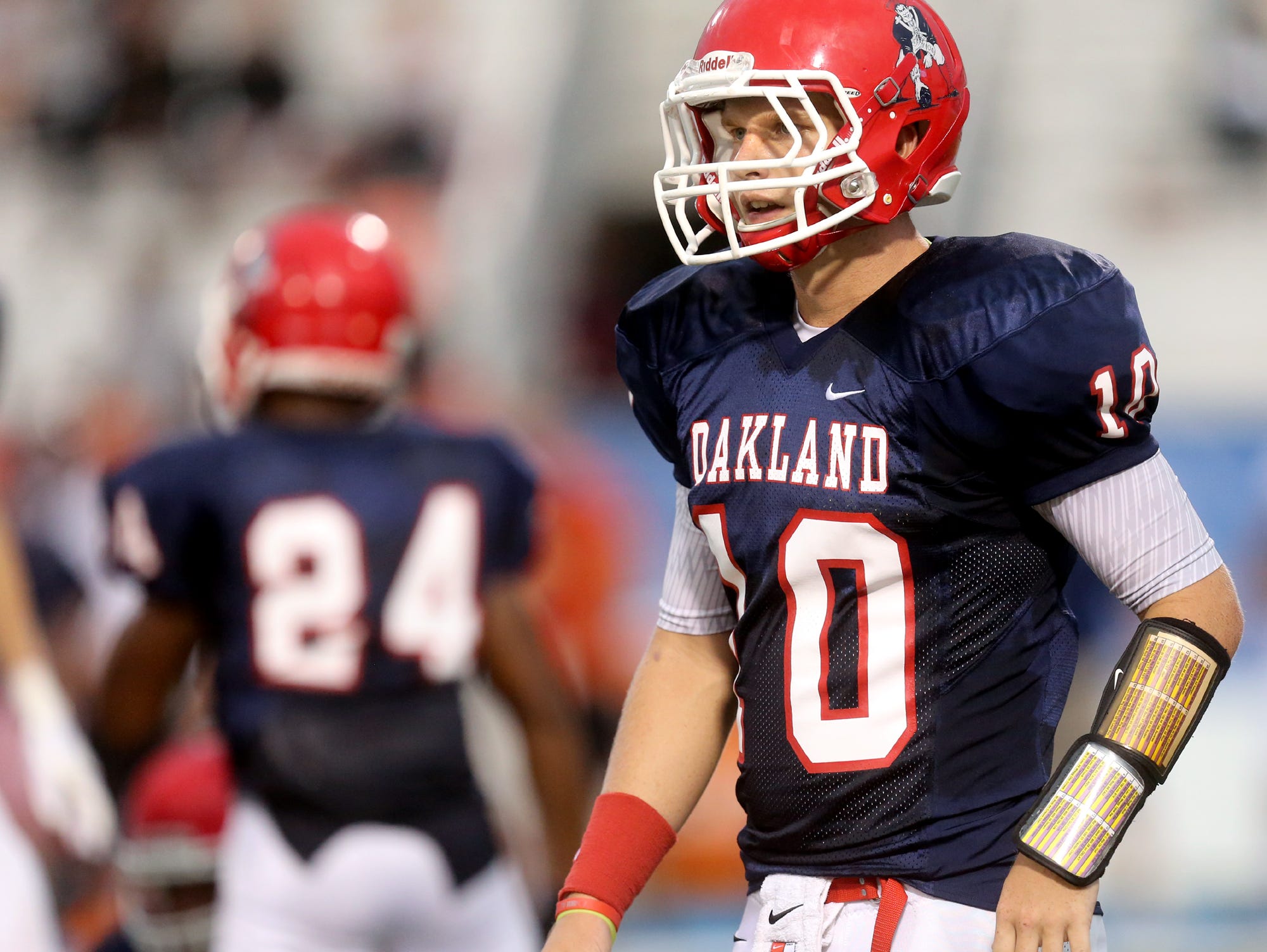 Oakland's quarterback Brendon Matthews (10), watches for direction from the coaches between plays of the Hoover at the Middle Tennessee Classic at MTSU's Floyd Stadium, on Saturday, Aug. 22, 2015.