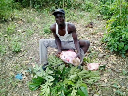 A young soothsayer in Tabora performs the rites necessary