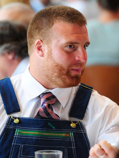 Green Bay Packers fullback John Kuhn wearing bib overalls and a tie during the 51st annual Welcome Back Packers Luncheon at the Lambeau Field Atrium, Wednesday, August 27, 2014.