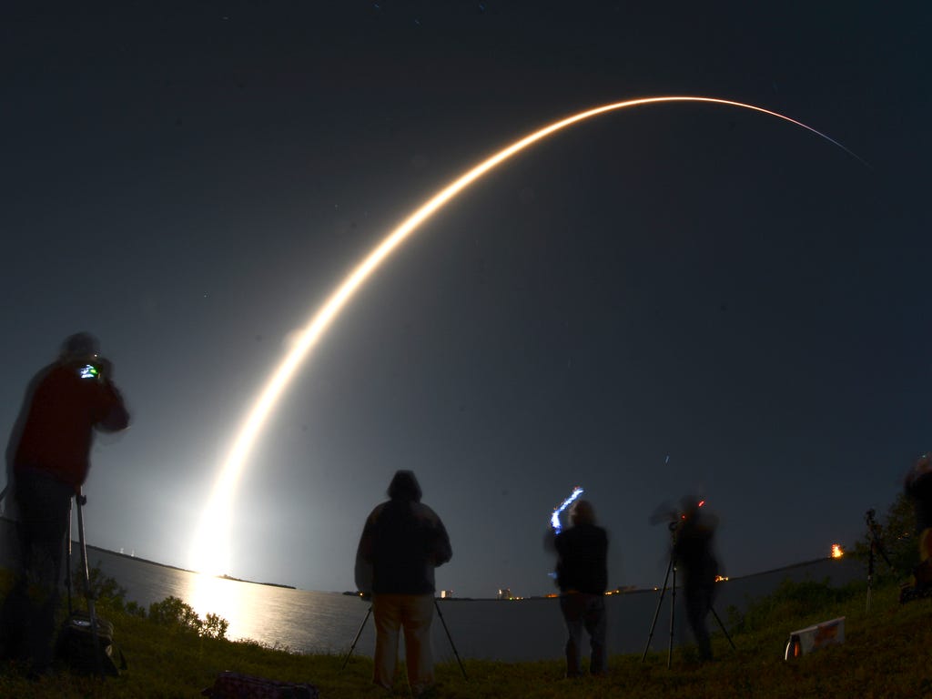A SpaceX Falcon 9 rocket lifts off from Pad 39A at Kennedy Space Center carrying the Echostar XXIII communications satellite.
