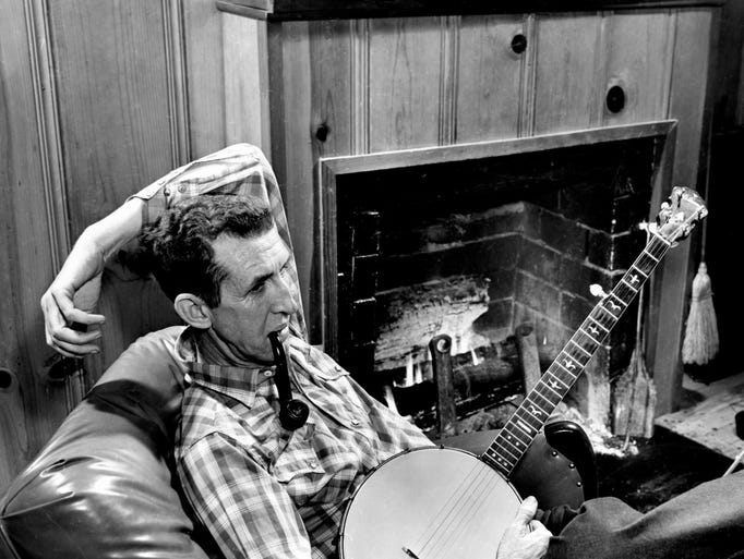 After breakfast March 20, 1962, Grand Ole Opry star Dave Akeman, known as Stringbean by his fans, sits in his leather reclining chair beside his fireplace for a few cups of coffee and to smoke his pipe before going fishing with his wife, Estelle.