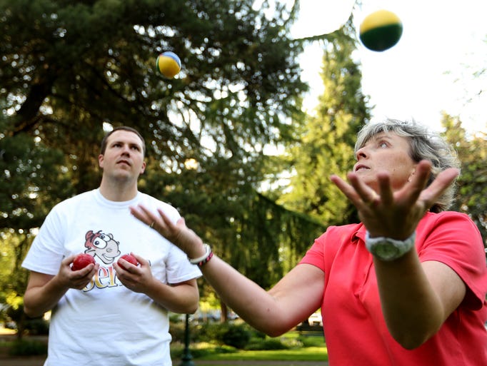 Corey teaches Capi Lynn to juggle