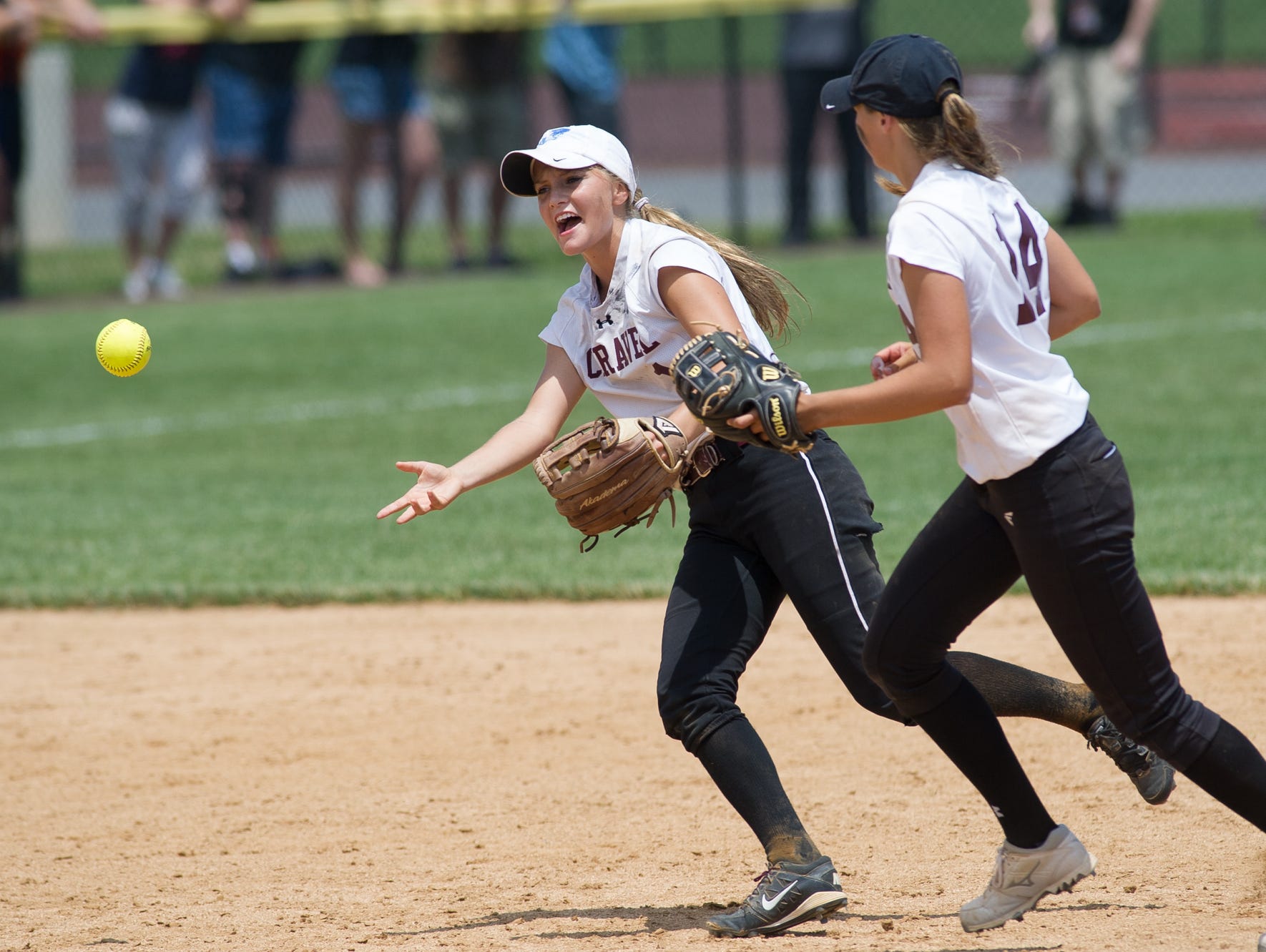 Caravel's Samantha Esper (1) throws the ball to the pitcher's area after making the final out of the 5th inning in the DIAA Softball State Championship game at Milford High School.