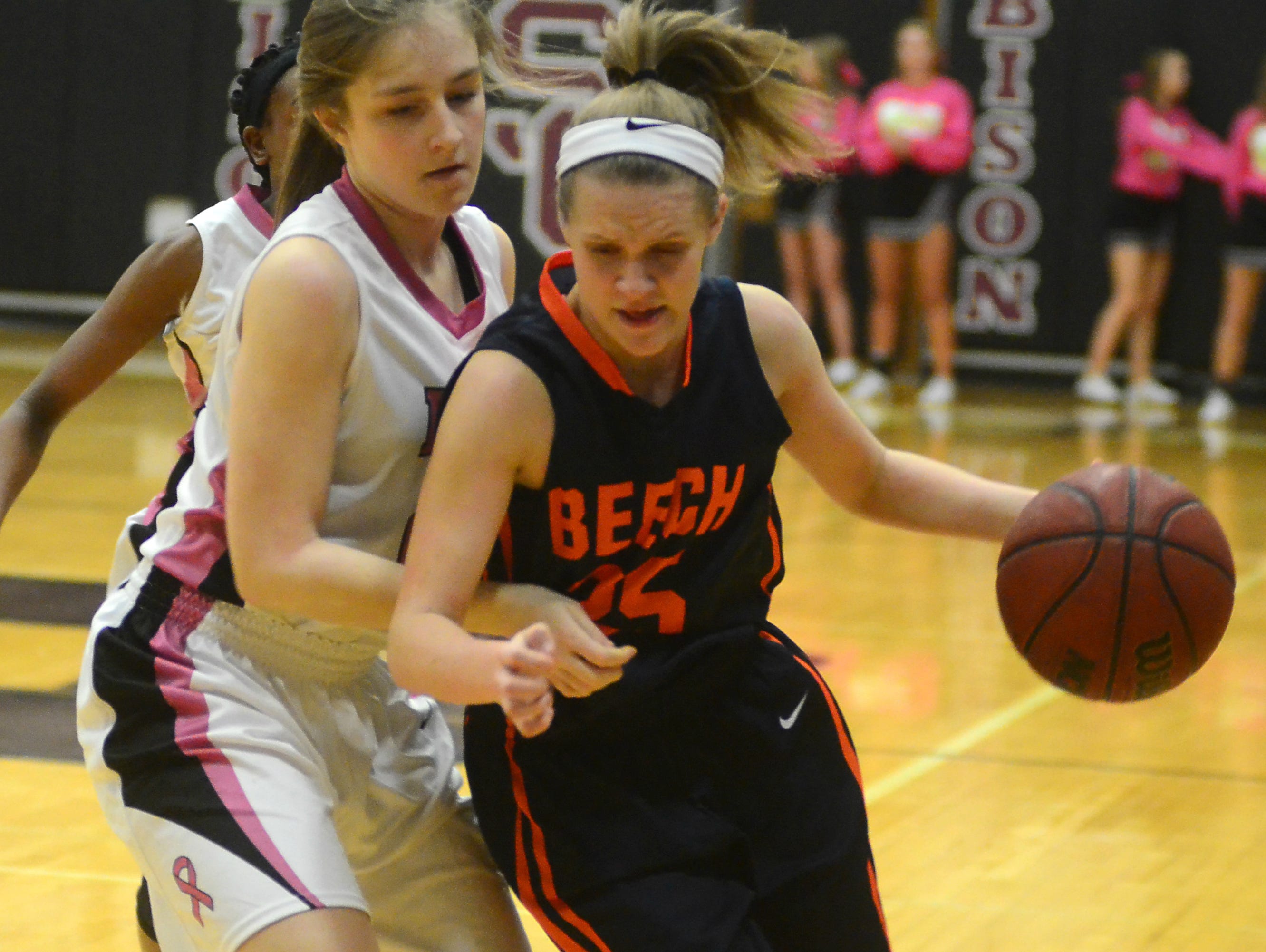 Beech High junior guard McCall Decker maneuvers around Station Camp sophomore Jessica Hopson during fourth-quarter action. Decker scored 14 points in the Lady Bucs’ 53-45 victory.
