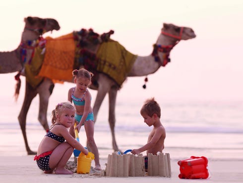 The Ritz-Carlton's new programs for children include adventures such as this encounter with camels in Dubai.