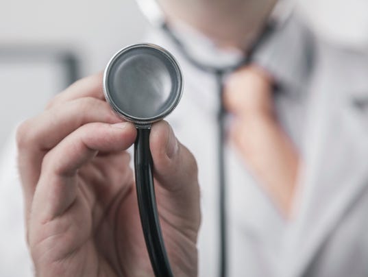 Close up of male doctor holding a stethoscope