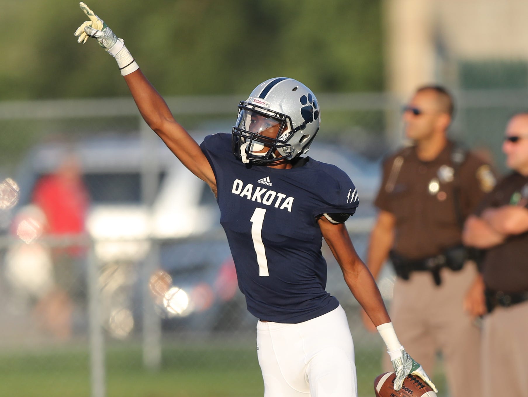 Macomb Dakota's Jaylen Hall catches a touchdown pass during the first half of Dakota's 35-28 win Thursday in Macomb.
