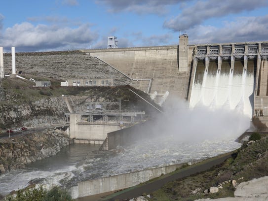Water rushes out of Folsom Dam in Folsom, California,
