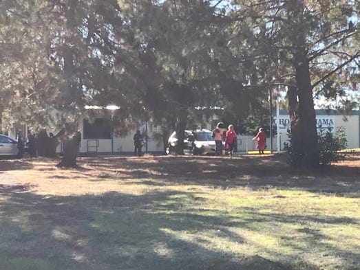 People linger near Rancho Tehama Elementary School
