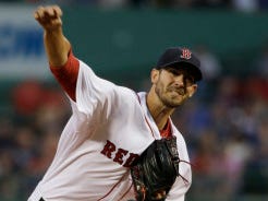 Boston pitcher Rick Porcello delivers in the first inning against the Yankees at Fenway Park on Tuesday. (AP Photo/Steven Senne)